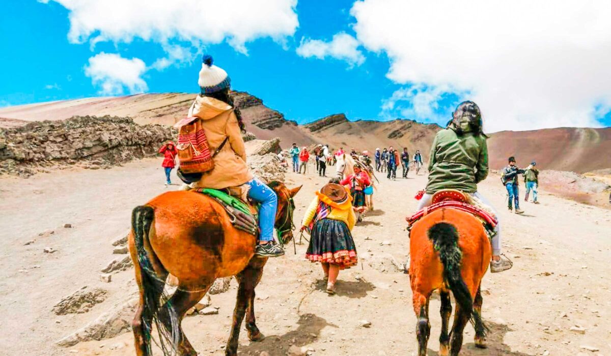 riding-horse-to-rainbow-mountain